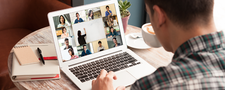 A student taking a non-credit nonprofit live online courses engages on his laptop during class with other students.