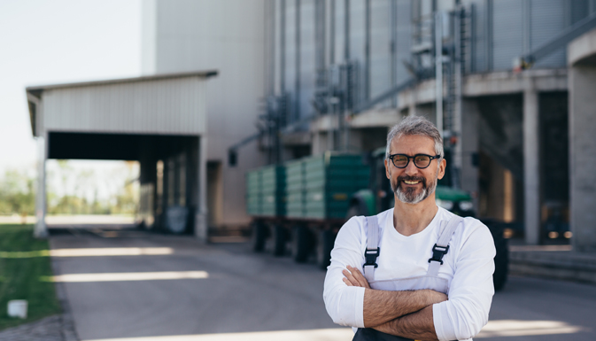 A facility manager smiles confidently as he completed facility management courses through UWM.